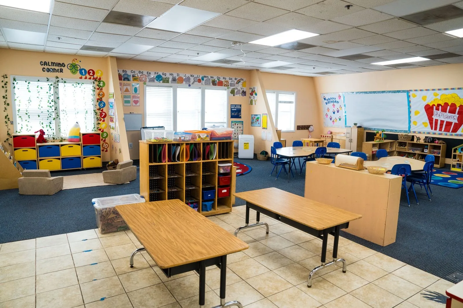 Wide view of the Pre-K classroom, from the calming corner to the work tables